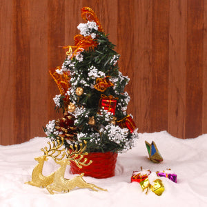 SNOWY CHRISTMAS TREE WITH DECORATIVE ORNAMENTS